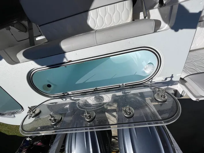  Yacht Photos Pics 2024 Sea Fox 288 Commander boat with open storage compartment and seating.