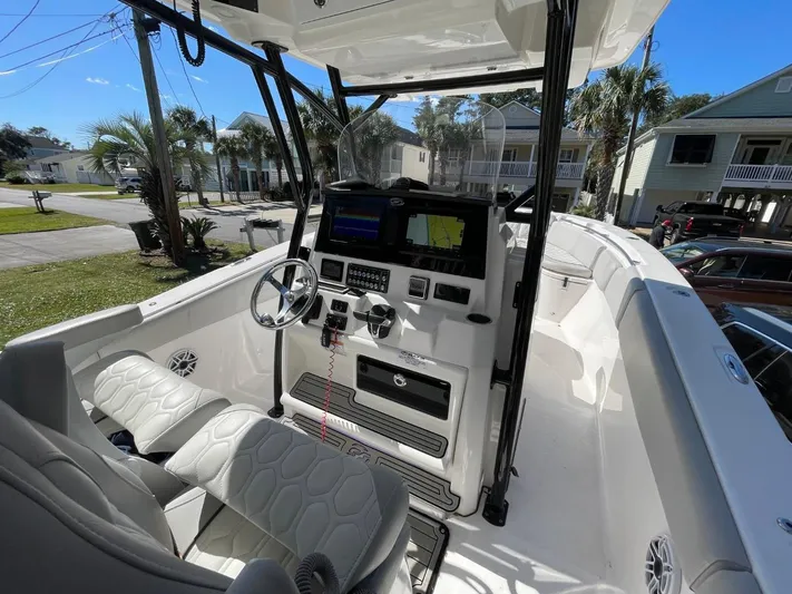  Yacht Photos Pics 2024 Sea Fox 288 Commander boat interior with modern dashboard and seating.