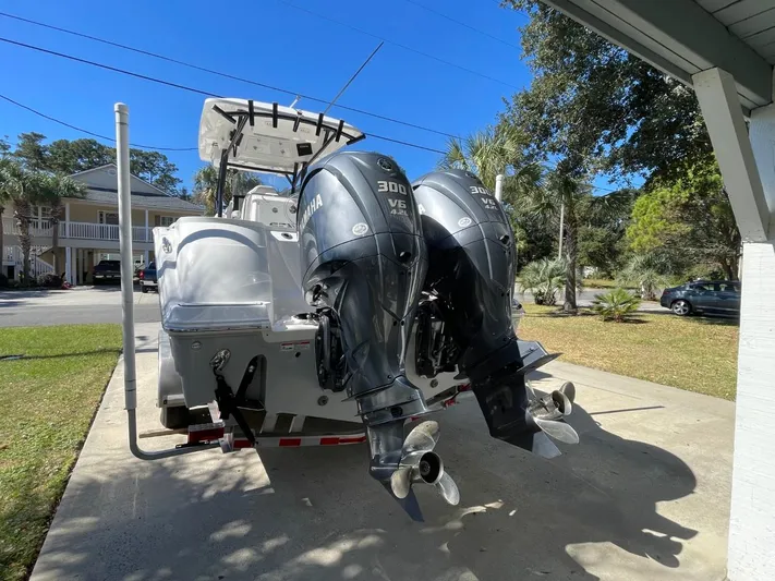  Yacht Photos Pics 2024 Sea Fox 288 Commander boat with dual Yamaha 300 V6 engines in driveway.