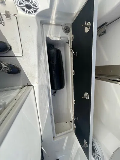  Yacht Photos Pics 2024 Sea Fox 288 Commander boat storage compartment with open hatch and visible speaker.