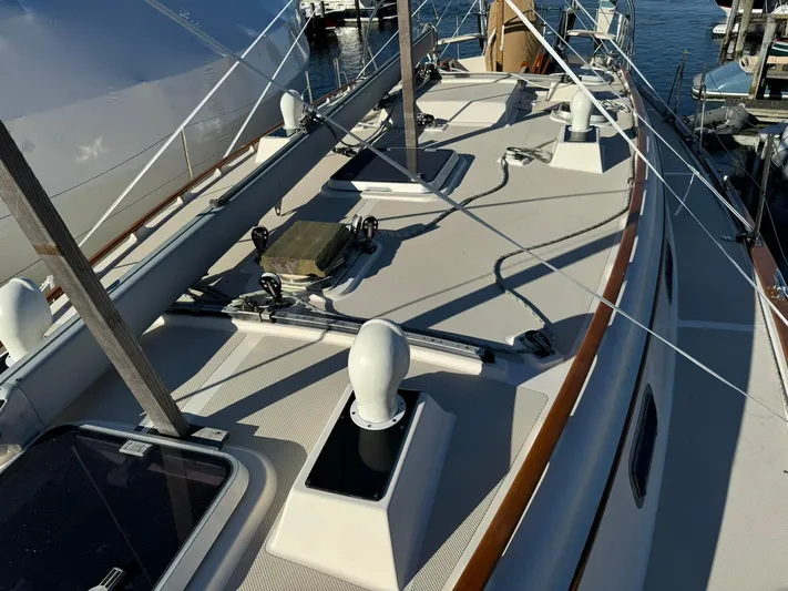 Essence Yacht Photos Pics 1998 Island Packet 40 sailboat deck with rigging and hatches, docked at marina.