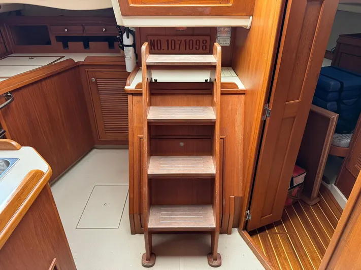 Essence Yacht Photos Pics Interior of 1998 Island Packet 40 sailboat with wooden steps and cabinetry.