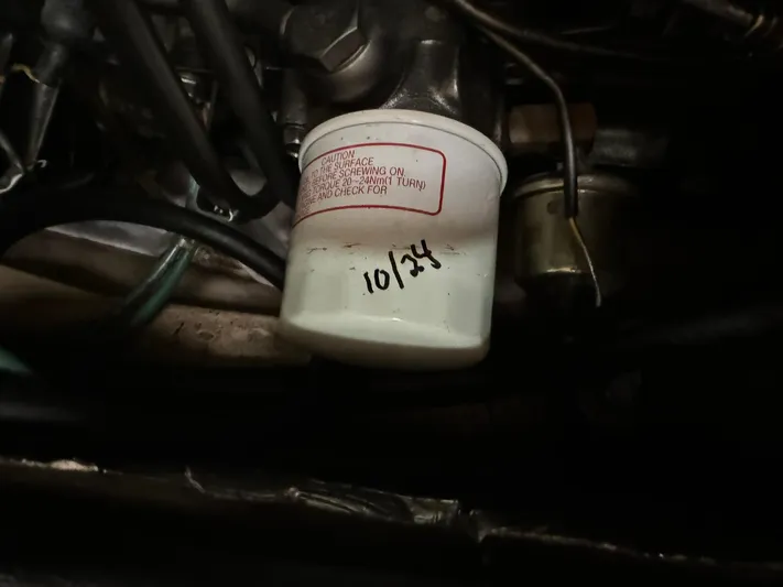 Essence Yacht Photos Pics Engine component of 1998 Island Packet 40 with marked filter dated 10/24.