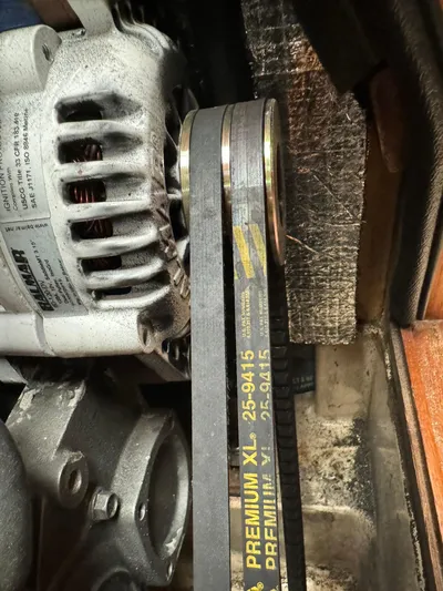 Essence Yacht Photos Pics Close-up of engine belt and alternator in 1998 Island Packet 40 sailboat.
