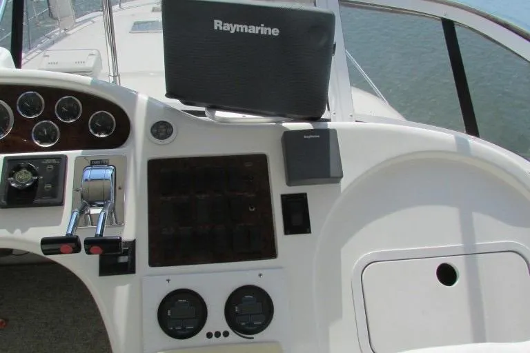  Yacht Photos Pics Control panel of a 2000 Sea Ray 400 Sedan Bridge with Raymarine equipment.