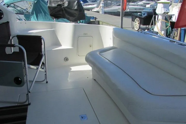  Yacht Photos Pics 2000 Sea Ray 400 Sedan Bridge yacht interior with seating and deck view.