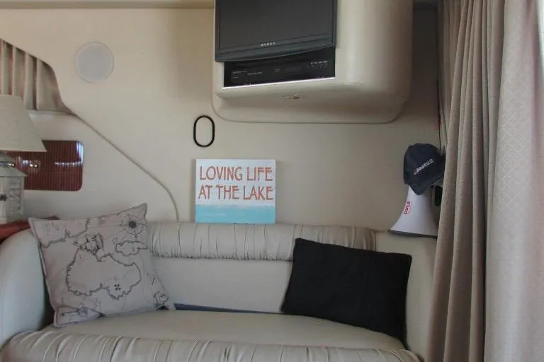  Yacht Photos Pics Interior of 2000 Sea Ray 400 Sedan Bridge with cozy seating and decor.