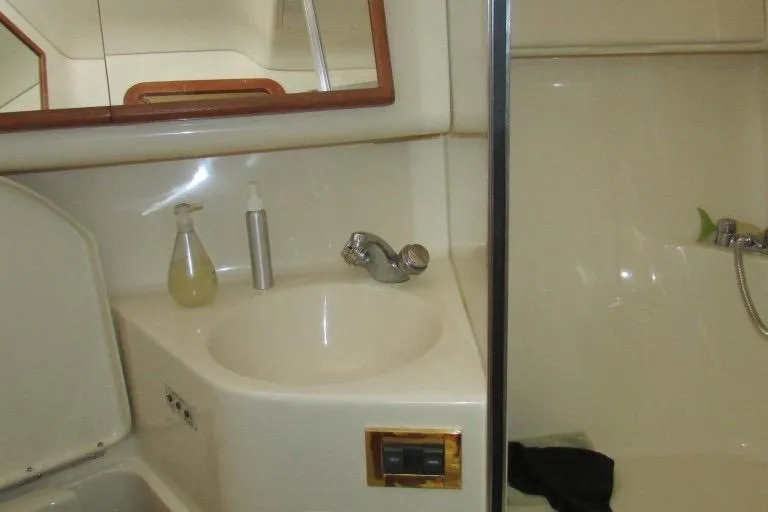  Yacht Photos Pics Bathroom interior of 2000 Sea Ray 400 Sedan Bridge yacht with sink and shower.