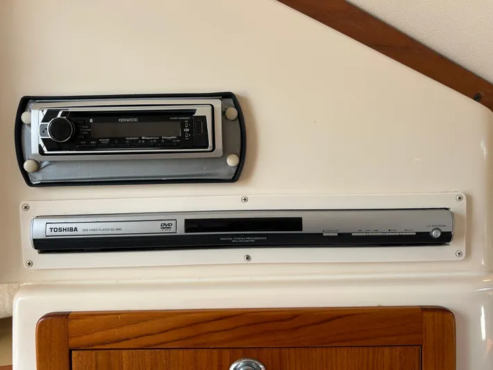 She Bot It II Yacht Photos Pics Kenwood stereo and Toshiba DVD player in 2007 Grady-White Express 305 boat interior.