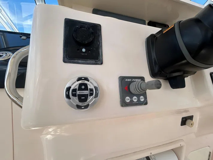 She Bot It II Yacht Photos Pics Control panel of a 2007 Grady-White Express 305 boat with Kenwood audio controls.