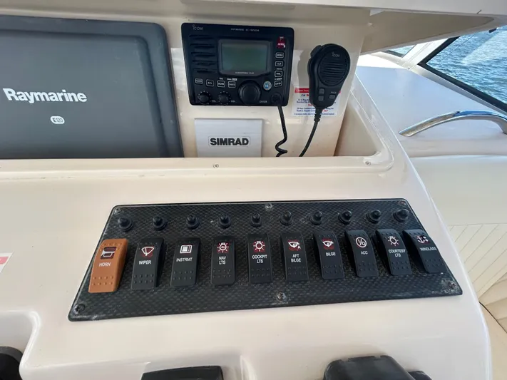 She Bot It II Yacht Photos Pics Control panel of a 2007 Grady-White Express 305 boat with Raymarine and Simrad equipment.