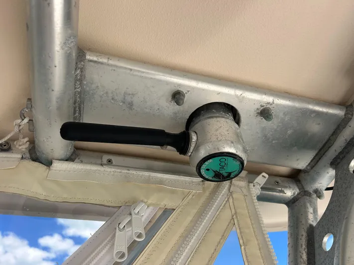 She Bot It II Yacht Photos Pics Close-up of a 2007 Grady-White Express 305 boat's T-top mount with TACO handle.