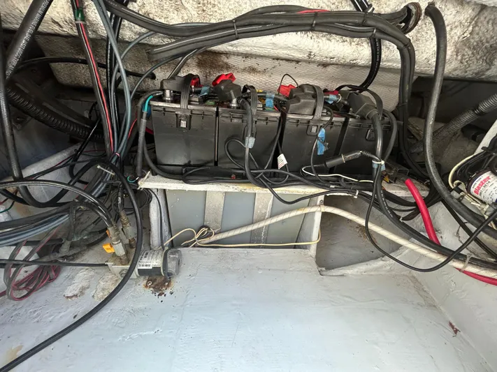 She Bot It II Yacht Photos Pics 2007 Grady-White Express 305 boat battery compartment with wiring and connections.