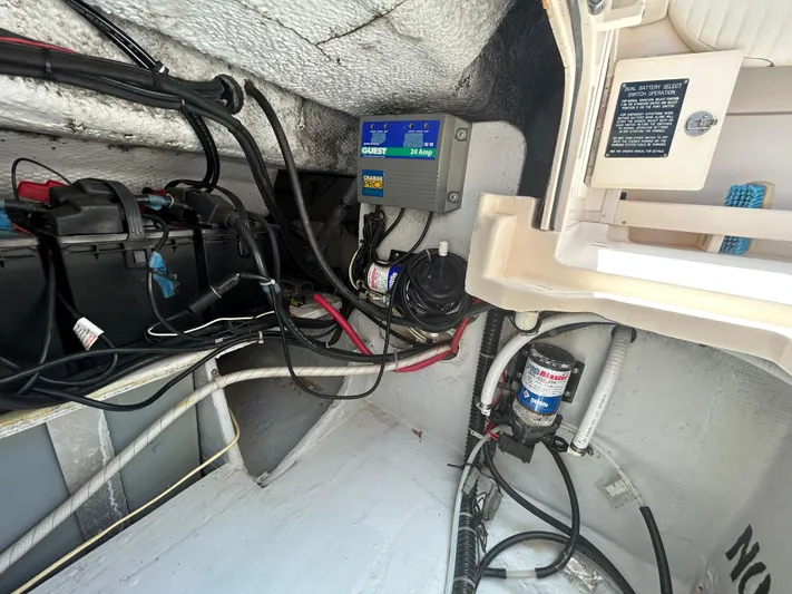 She Bot It II Yacht Photos Pics 2007 Grady-White Express 305 boat interior showing electrical wiring and battery setup.
