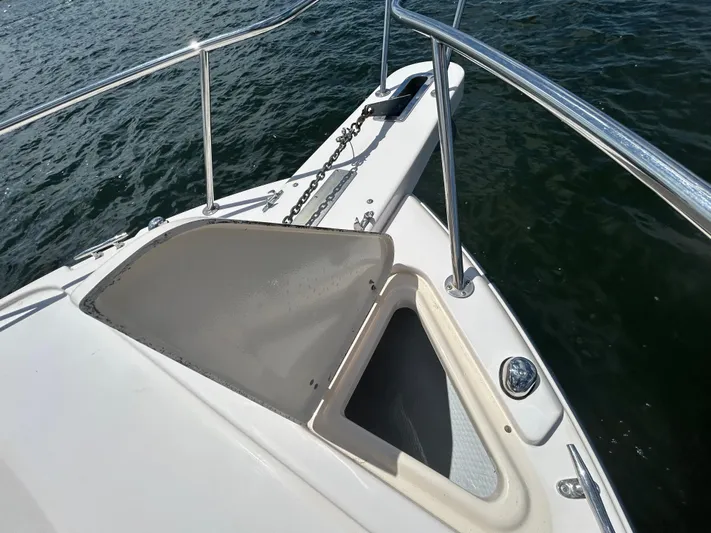 She Bot It II Yacht Photos Pics 2007 Grady-White Express 305 boat bow with anchor chain on water.