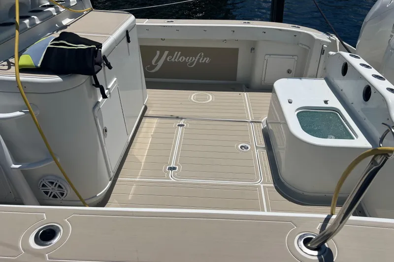  Yacht Photos Pics 2011 Yellowfin 42 Offshore boat deck with storage and fishing equipment.