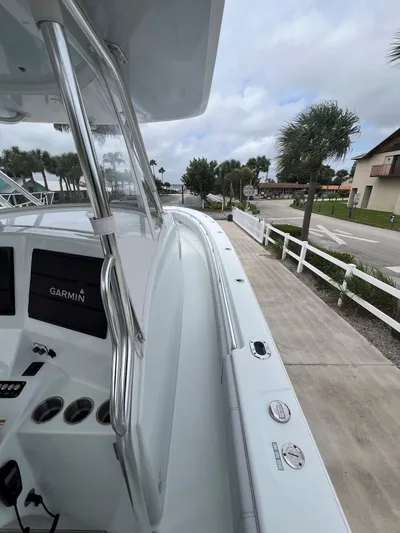 No Name Yacht Photos Pics 2022 Contender 39 Fisharound boat with Garmin electronics, docked near palm trees.