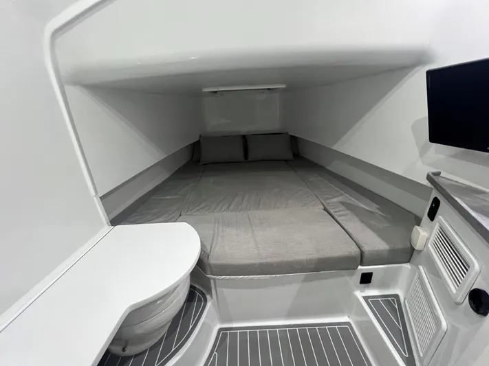 No Name Yacht Photos Pics 2022 Contender 39 Fisharound cabin interior with bed, TV, and compact design.
