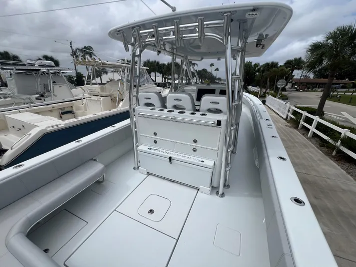 No Name Yacht Photos Pics 2022 Contender 39 Fisharound boat with spacious deck and seating, docked at marina.