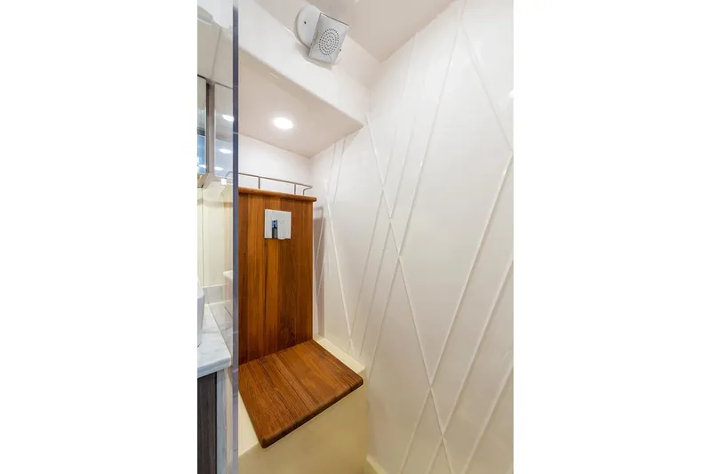  Yacht Photos Pics Manufacturer Provided Image: 2020 Regal 38 SAV boat shower with wooden seat and modern design.