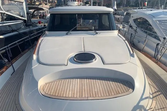  Yacht Photos Pics 2007 Apreamare 48 yacht docked at marina, showcasing sleek design and spacious deck.