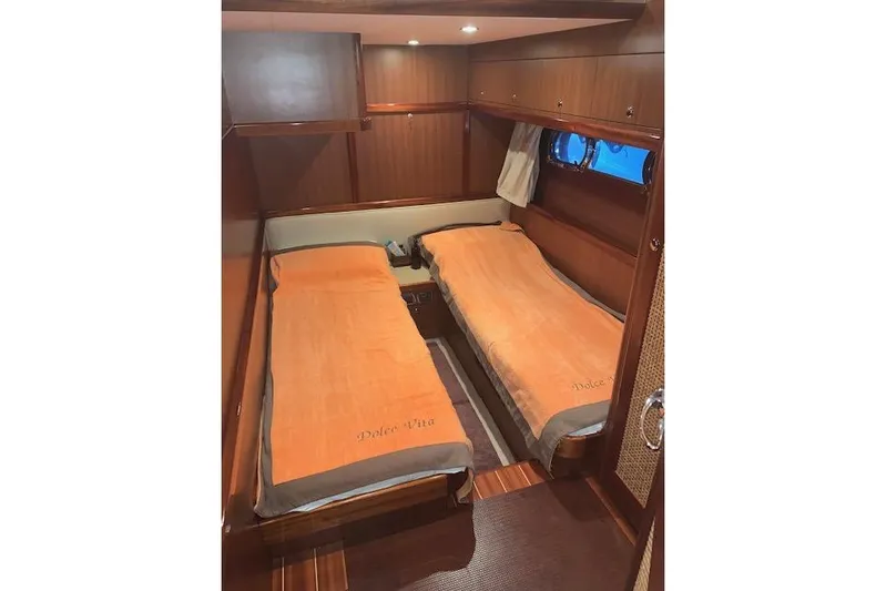  Yacht Photos Pics Twin cabin with orange bedding in 2007 Apreamare 48 yacht interior.
