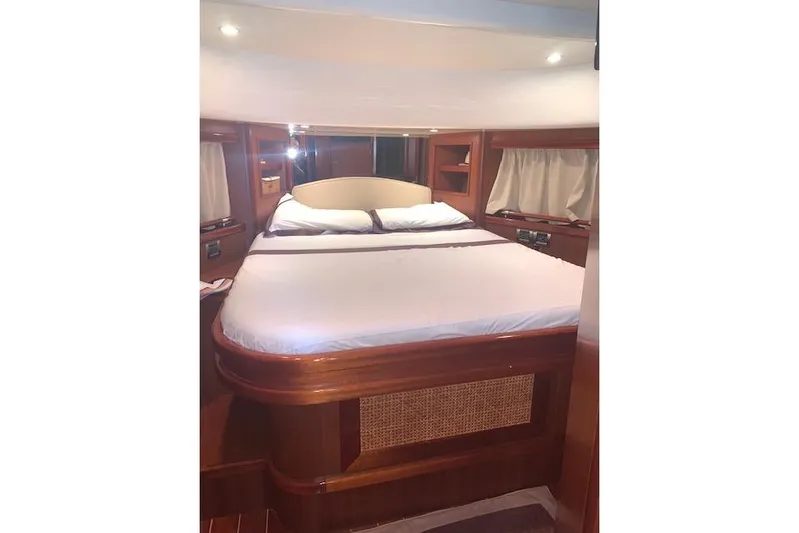  Yacht Photos Pics Luxurious cabin interior of 2007 Apreamare 48 yacht with elegant wood finish.