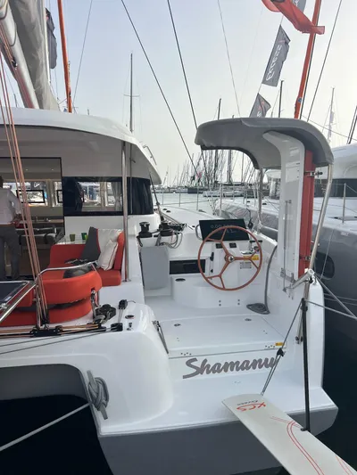  Yacht Photos Pics 2024 Excess 14 yacht with red accents docked at marina.