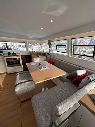  Yacht Photos Pics 2024 Excess 14 yacht interior with modern dining area and panoramic windows.