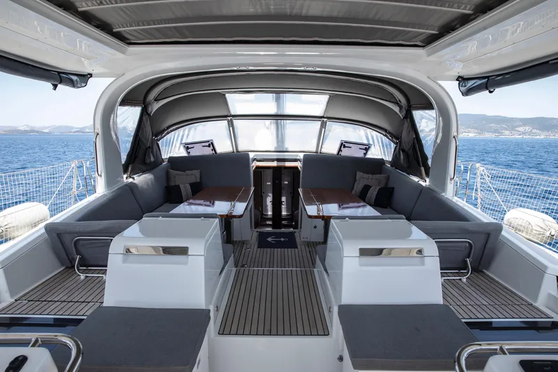  Yacht Photos Pics Luxurious 2020 Jeanneau 64 yacht interior with spacious seating and ocean view.