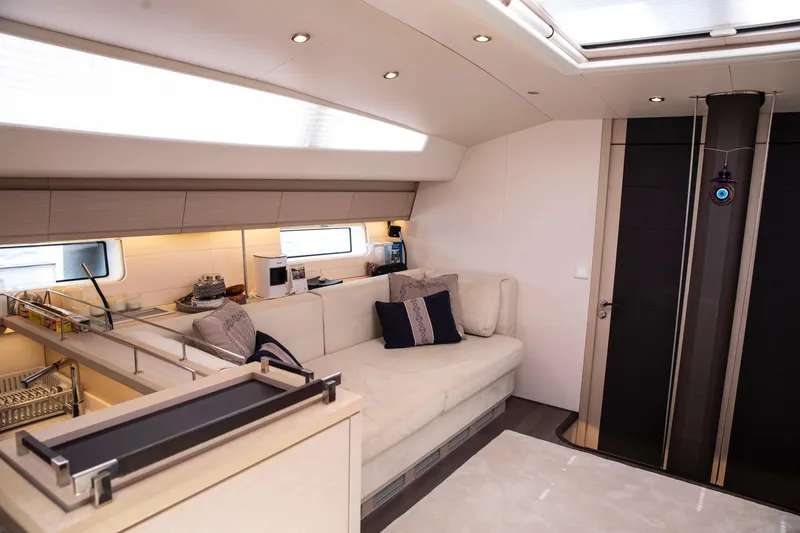  Yacht Photos Pics Luxurious interior of 2020 Jeanneau 64 yacht with modern furnishings and elegant design.