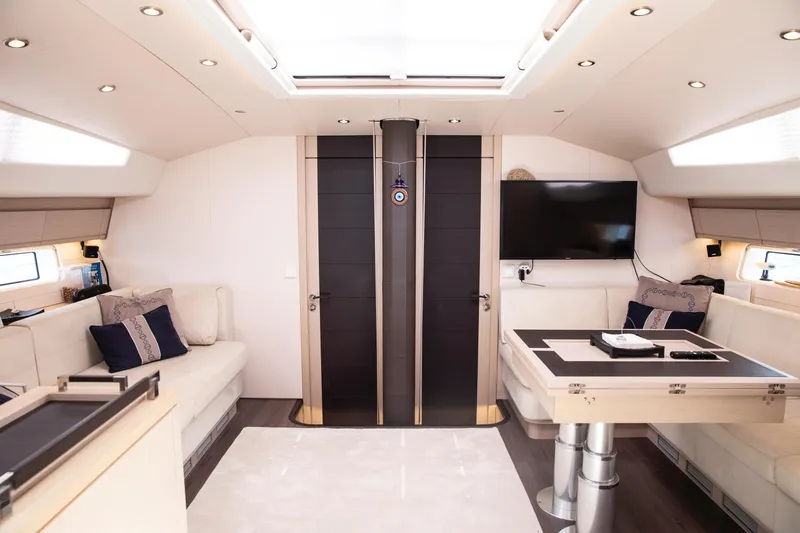  Yacht Photos Pics Luxurious interior of a 2020 Jeanneau 64 yacht with modern furnishings and elegant design.