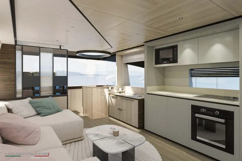  Yacht Photos Pics Luxurious interior of 2025 MandaYachts S7 BERLINETTA with modern kitchen and cozy seating area.