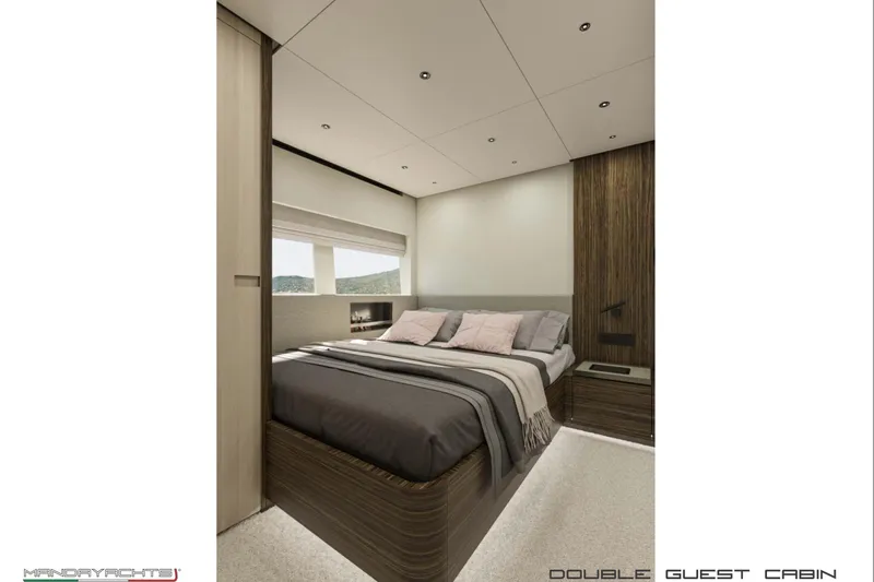  Yacht Photos Pics Luxurious double guest cabin in 2025 MandaYachts S7 BERLINETTA, featuring modern design and cozy bedding.