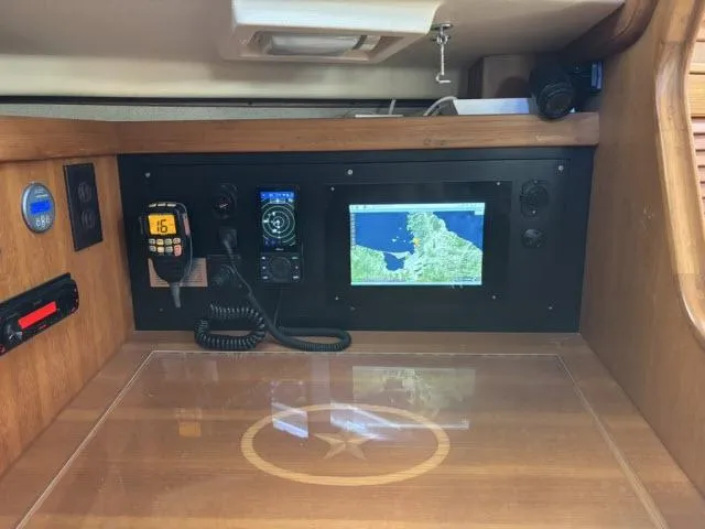 Pelican Yacht Photos Pics Navigation station of 2008 Island Packet 370 sailboat with GPS and communication equipment.
