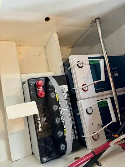 Pelican Yacht Photos Pics Battery compartment of a 2008 Island Packet 370 sailboat, featuring multiple batteries.