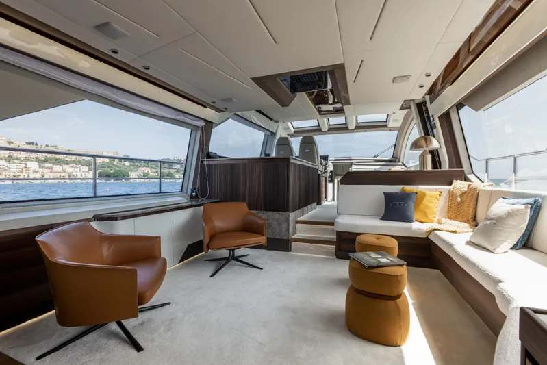  Yacht Photos Pics Luxurious interior of the 2024 Aicon Vivere 66' yacht with modern seating and panoramic windows.