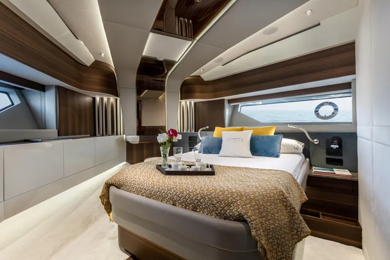  Yacht Photos Pics Luxurious bedroom interior of 2024 Aicon Vivere 66' yacht with modern design and ocean view.