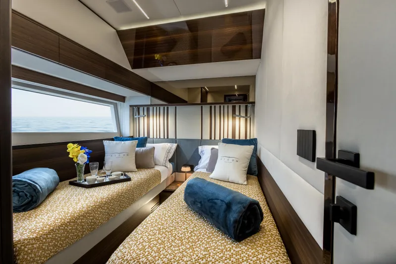  Yacht Photos Pics Luxurious twin bedroom on the 2024 Aicon Vivere 66' yacht with ocean view.