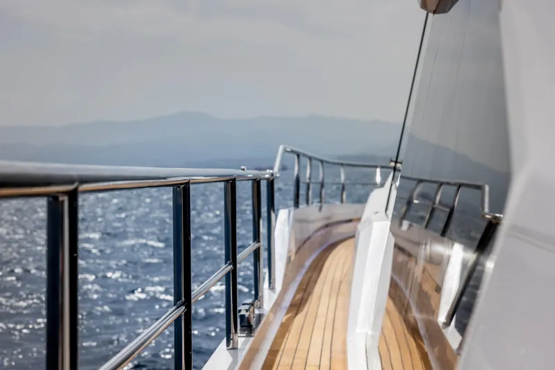  Yacht Photos Pics Side deck view of the 2024 Aicon Vivere 66' yacht cruising on the ocean.