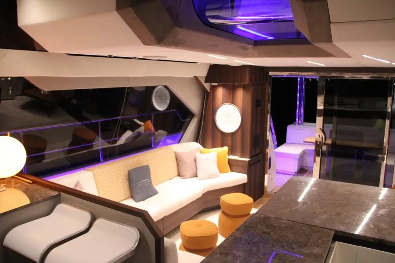  Yacht Photos Pics Luxurious interior of 2024 Aicon Vivere 66' yacht with modern seating and ambient lighting.