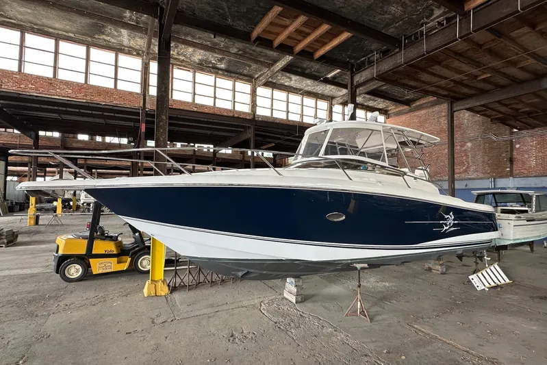  Yacht Photos Pics 2006 Sunseeker Sportfisher 37 boat in warehouse, elevated on supports.