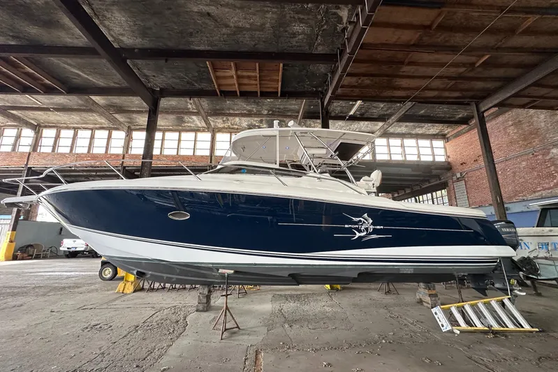  Yacht Photos Pics 2006 Sunseeker Sportfisher 37 boat in warehouse, side view.