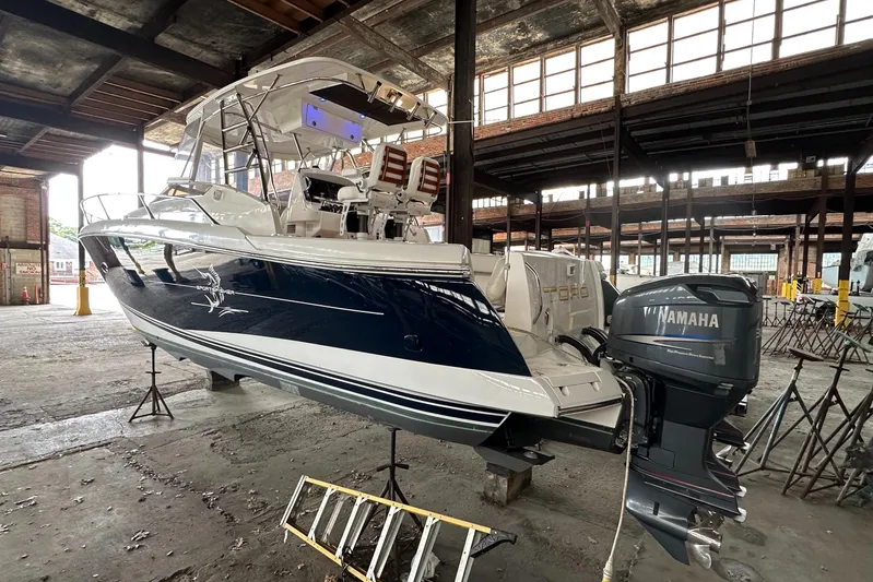  Yacht Photos Pics 2006 Sunseeker Sportfisher 37 in a warehouse, featuring Yamaha outboard engines.