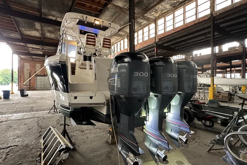  Yacht Photos Pics 2006 Sunseeker Sportfisher 37 with Yamaha engines in a warehouse setting.