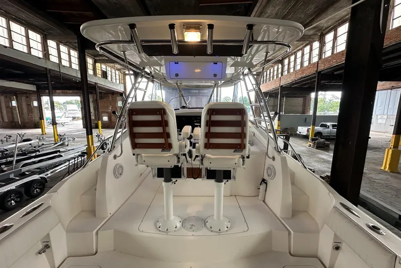  Yacht Photos Pics 2006 Sunseeker Sportfisher 37 interior with dual helm seats in a warehouse setting.