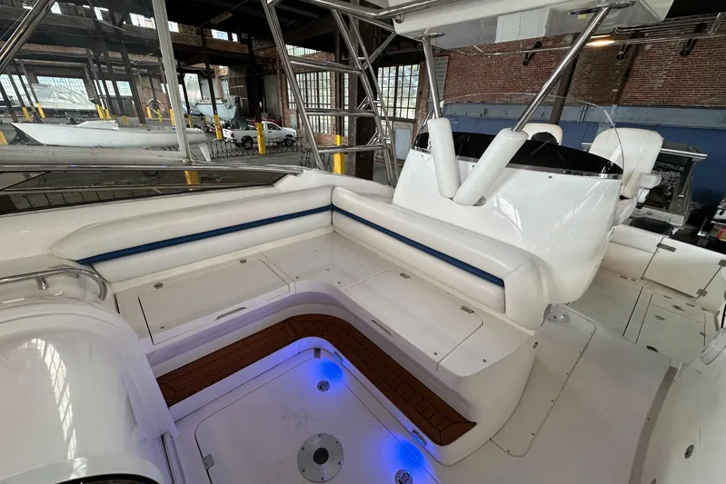  Yacht Photos Pics 2006 Sunseeker Sportfisher 37 interior with white seating and blue LED lighting.