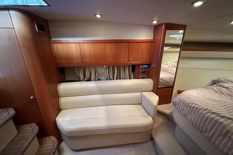  Yacht Photos Pics Luxurious interior of 2006 Sunseeker Sportfisher 37 yacht with cozy seating and wood cabinetry.