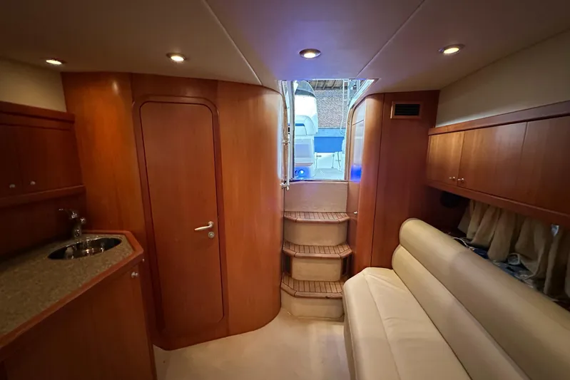  Yacht Photos Pics Interior of 2006 Sunseeker Sportfisher 37 yacht with wood paneling and seating area.