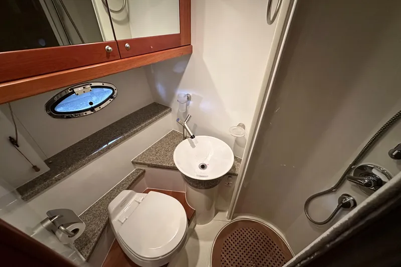  Yacht Photos Pics Bathroom interior of 2006 Sunseeker Sportfisher 37 yacht with sink, toilet, and shower.